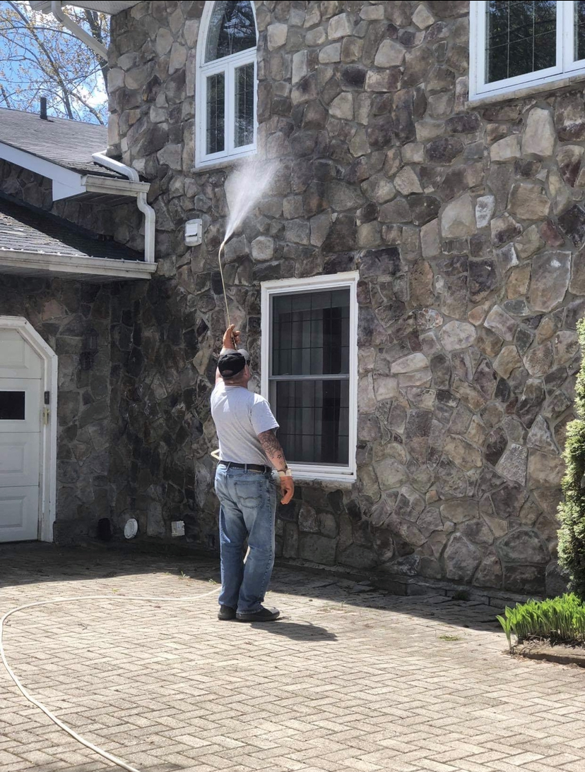 Dave spraying for spiders in Kawartha Lakes, Ontario.
